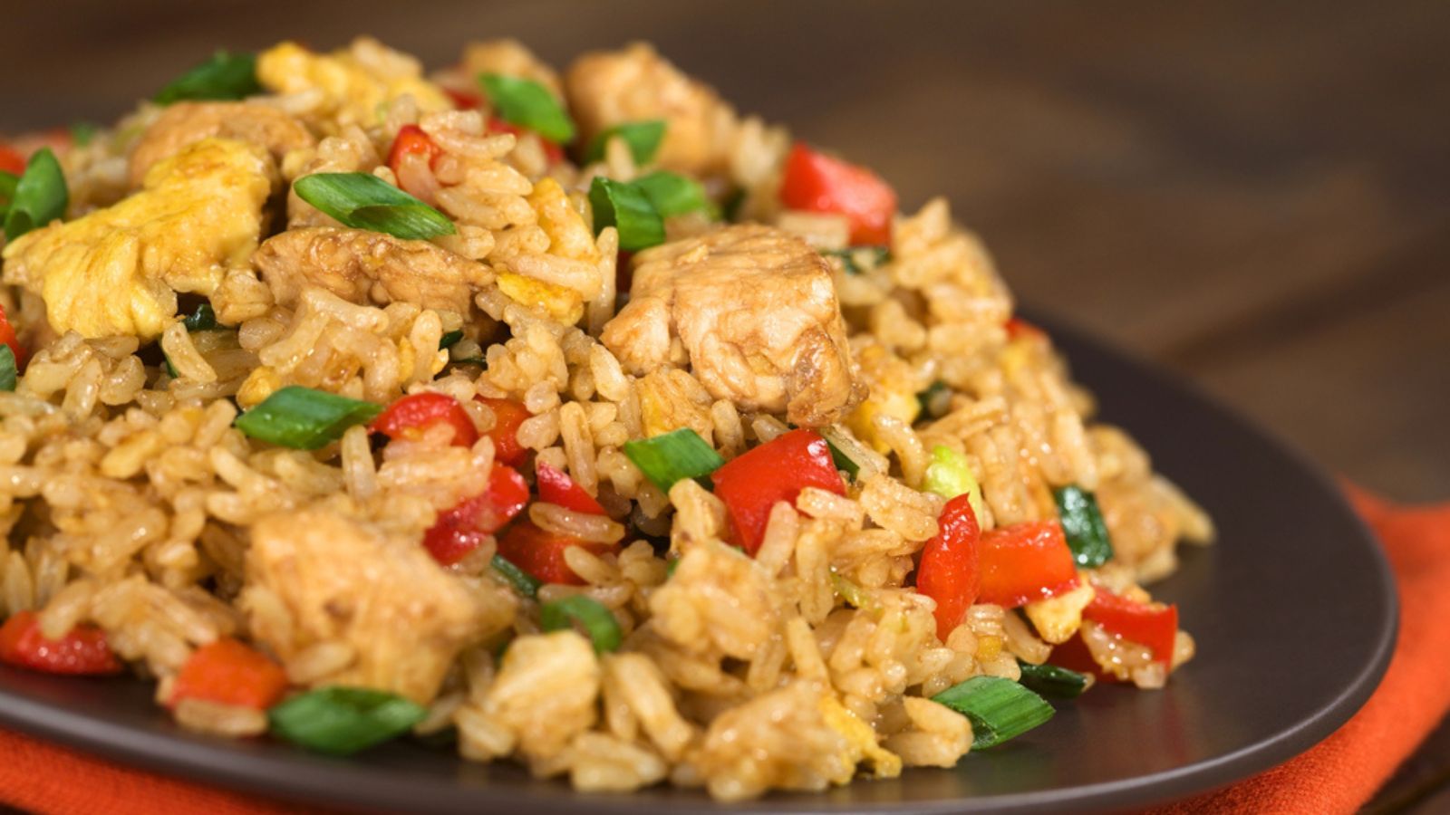 Homemade Chinese fried rice with vegetables, chicken and fried eggs